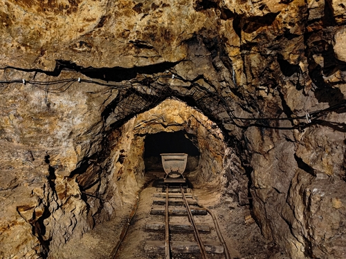 Old,Underground,Mine,Tunnel,,Mining,Cart,And,Tracks.,Rocky,,Narrow