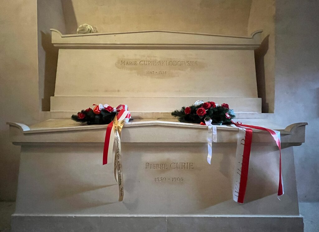 Flowers and ribbons on the tomb of Marie and Pierre Curie in the Panthéon