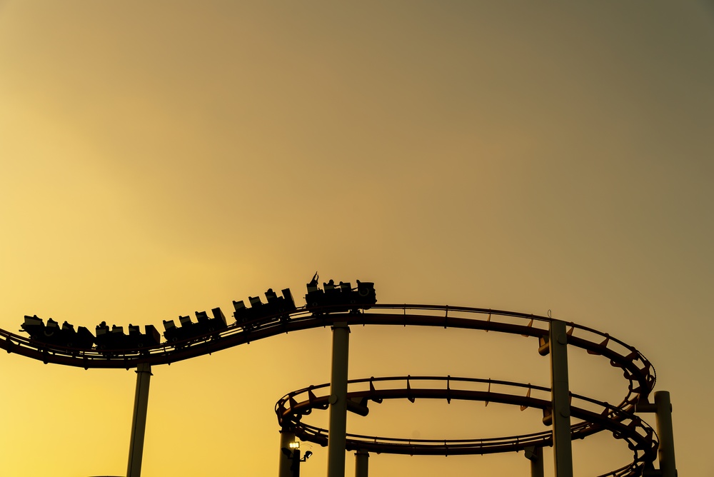 Silhouette,Of,A,Roller,Coaster,Rises,Against,A,Glowing,Sunset