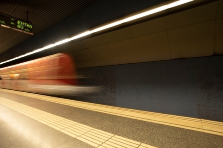 Madrid metro train arriving at a station
